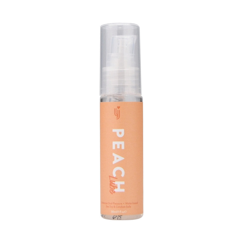 Peach-colored cosmetic bottle with clear cap on a white background