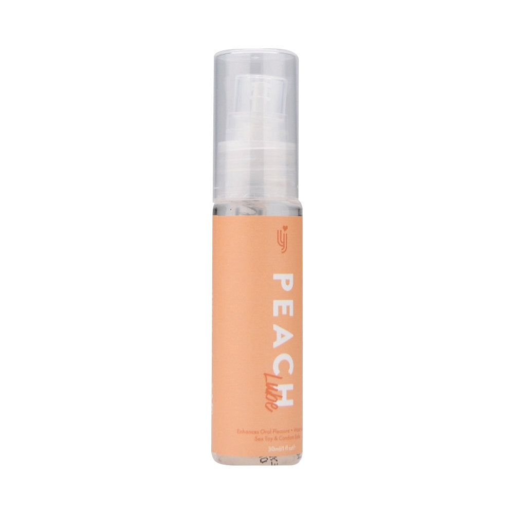 Peach-colored cosmetic bottle with a white cap on a white background