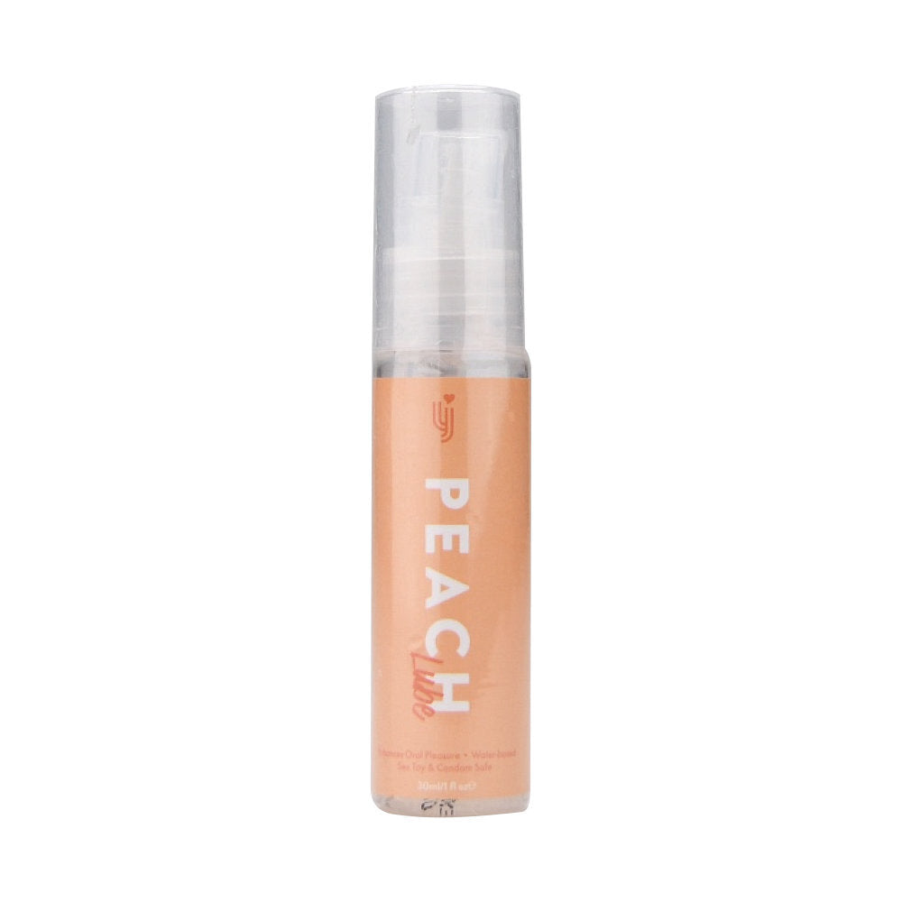 Peach-colored cosmetic bottle with clear cap on a white background