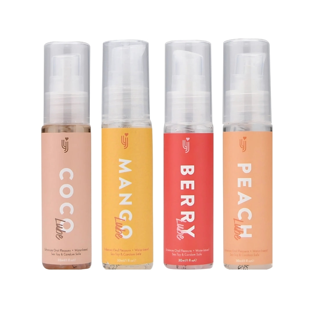 Four spray bottles labeled 'Coco', 'Mango', 'Berry', and 'Peach' on a white background.