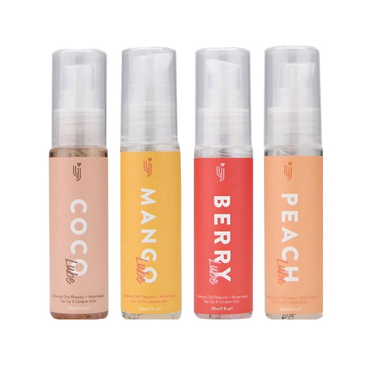 Four spray bottles labeled 'Coco', 'Mango', 'Berry', and 'Peach' on a white background.